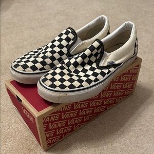 Vans Black and White Sneakers with Classic Slip-On Design